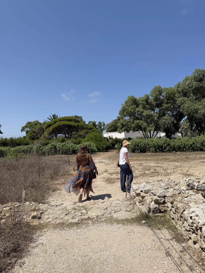 Dr. Caroline Nickerson and Dr. Laura Harrison walking through a site in Tunisia, August 2026
