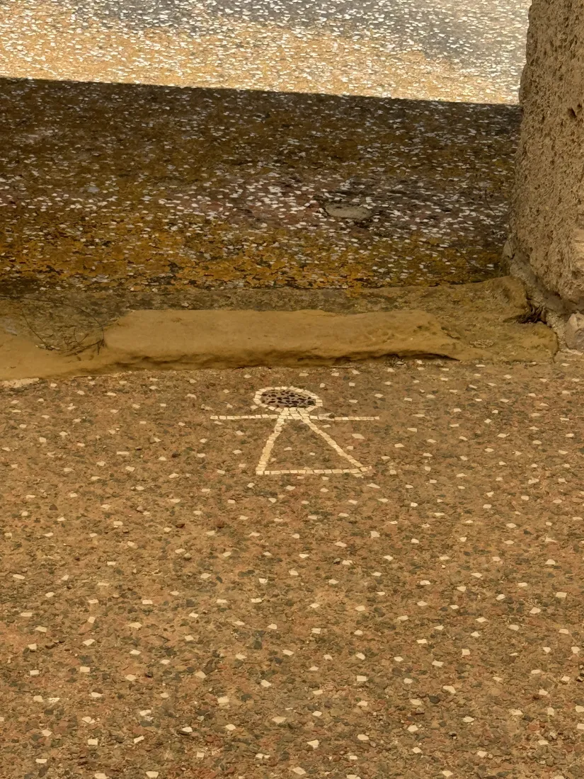 The sign of Tanit set into a mosaic floor